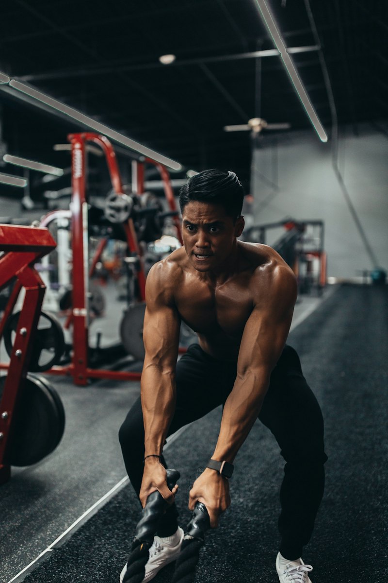 Ilya P., hypertrophy coach, pulling on a rower