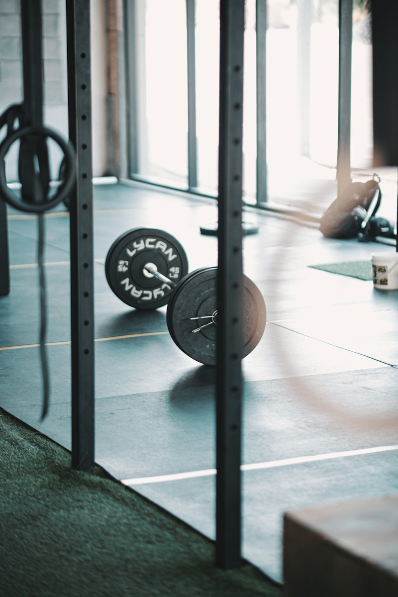 A loaded barbell resting on the rack